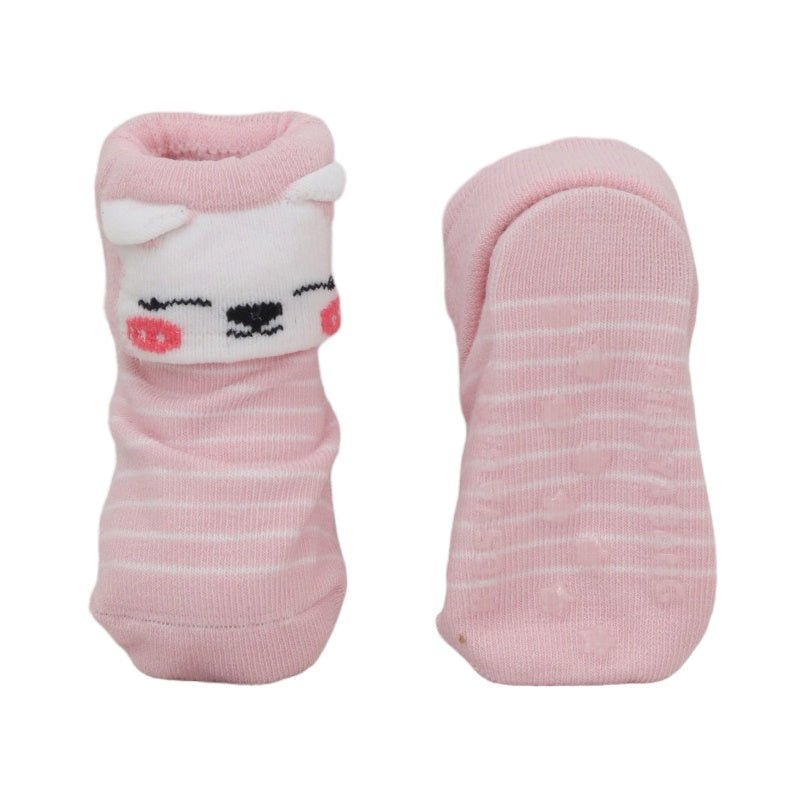 Yellow Bee's pink baby socks with animal details, displayed side by side to show the pattern and anti-skid sole