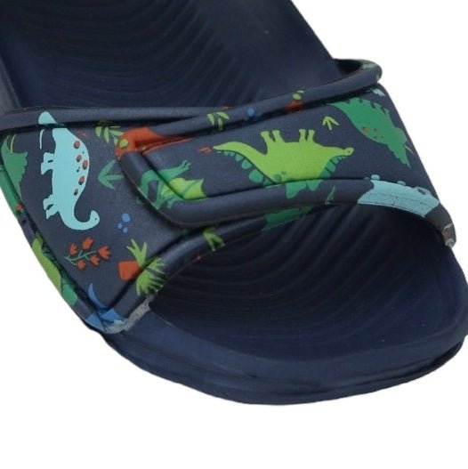 Close-up view highlighting the detail of the dinosaur print on the navy sandal straps.