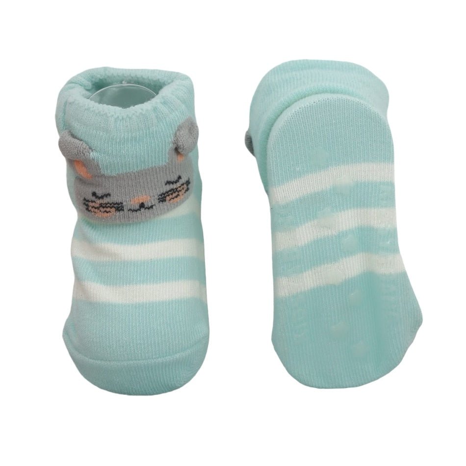 Anti-skid soles of Grey duckling socks for baby girls, showcasing the grip texture