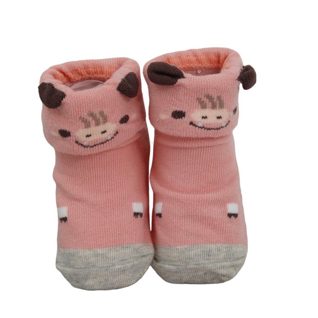 Pink cow-themed anti-skid socks for baby girls.