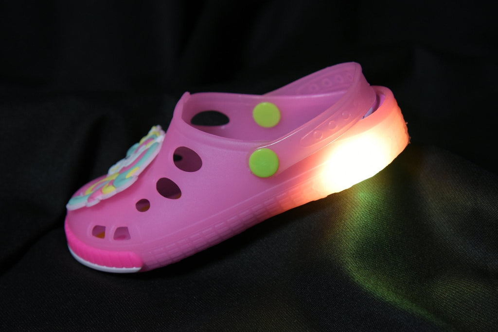 Illuminated Pink Unicorn LED Clogs for Girls in low light setting