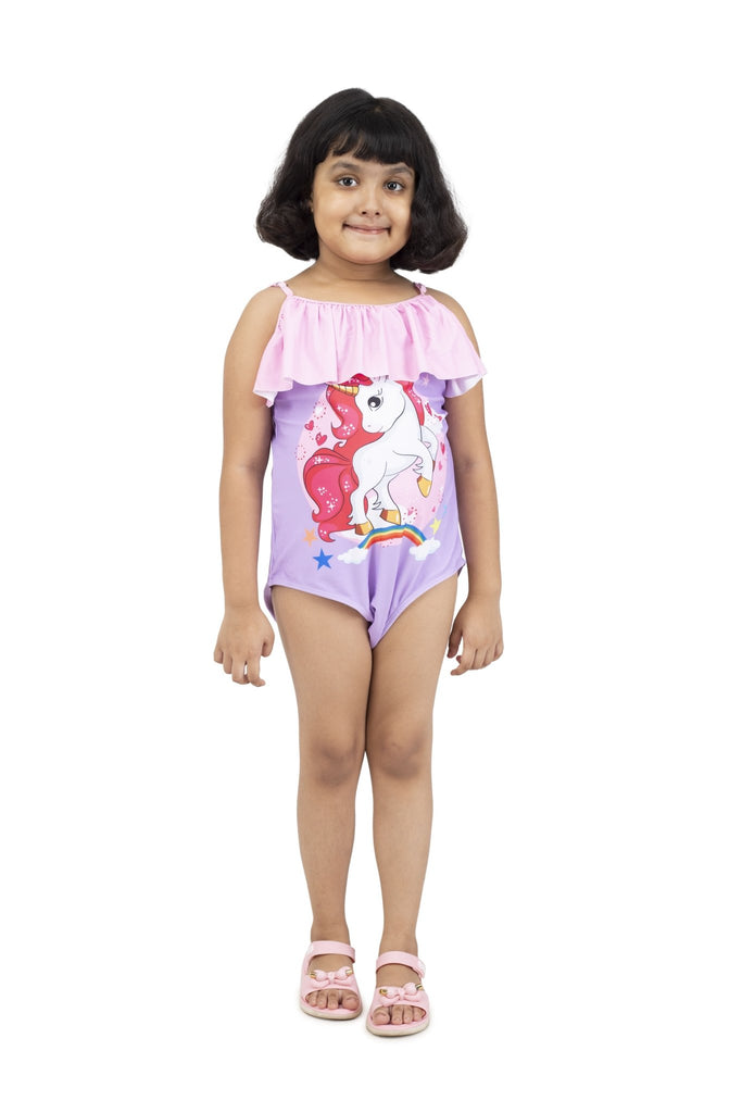 Front View of Girl Smiling in Yellow Bee's Unicorn Swimsuit with Ruffles