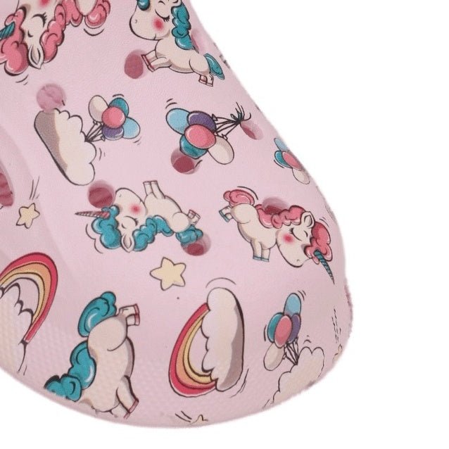 Close-up of the pink unicorn clog's pattern with colorful illustrations and stars