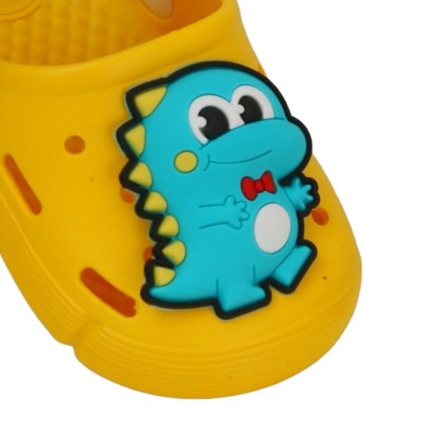 Close-up of the cute dino applique on Yellow Bee's transformable clogs for boys.