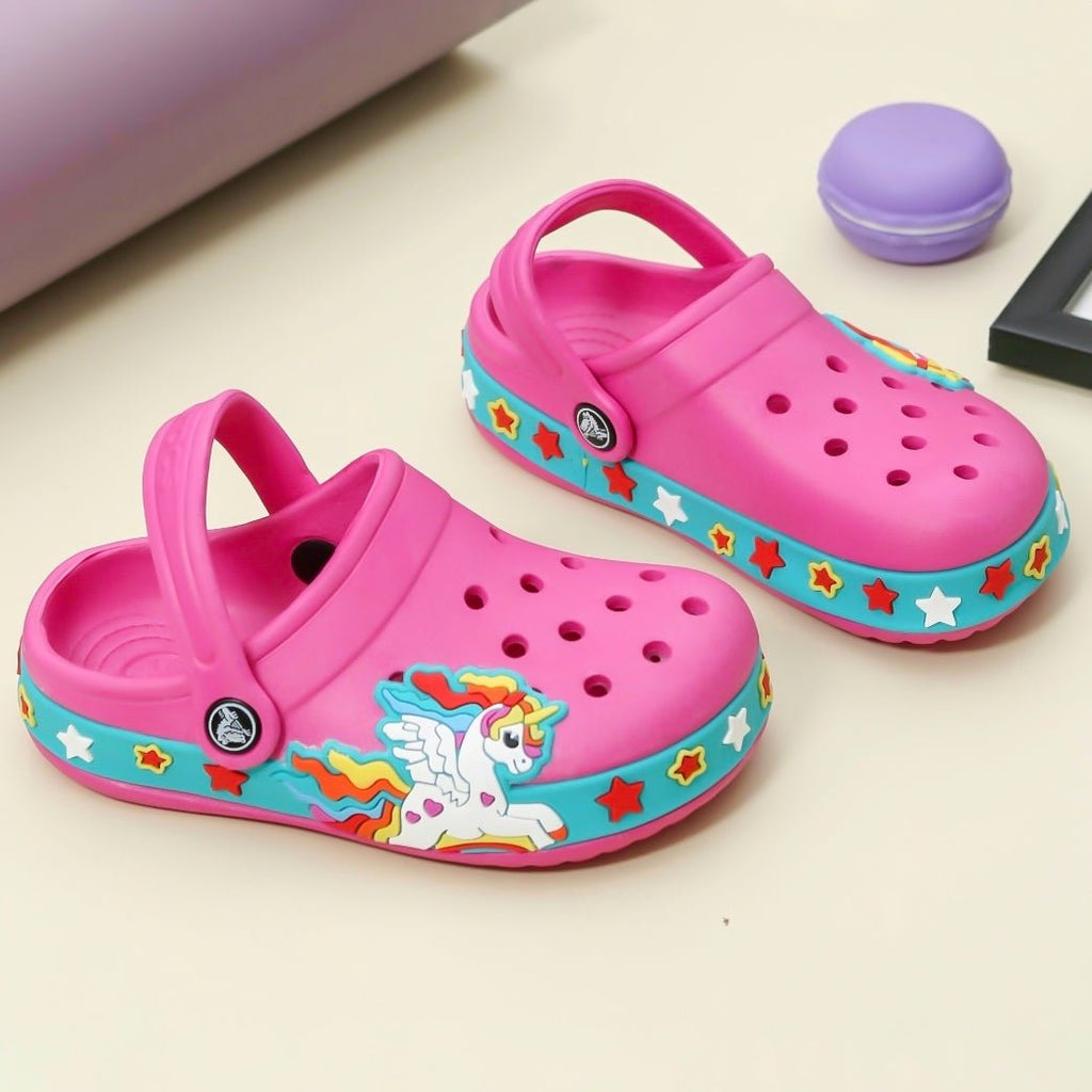 Pair of fuchsia kids' clogs with a unicorn and stars design, ideal for imaginative play