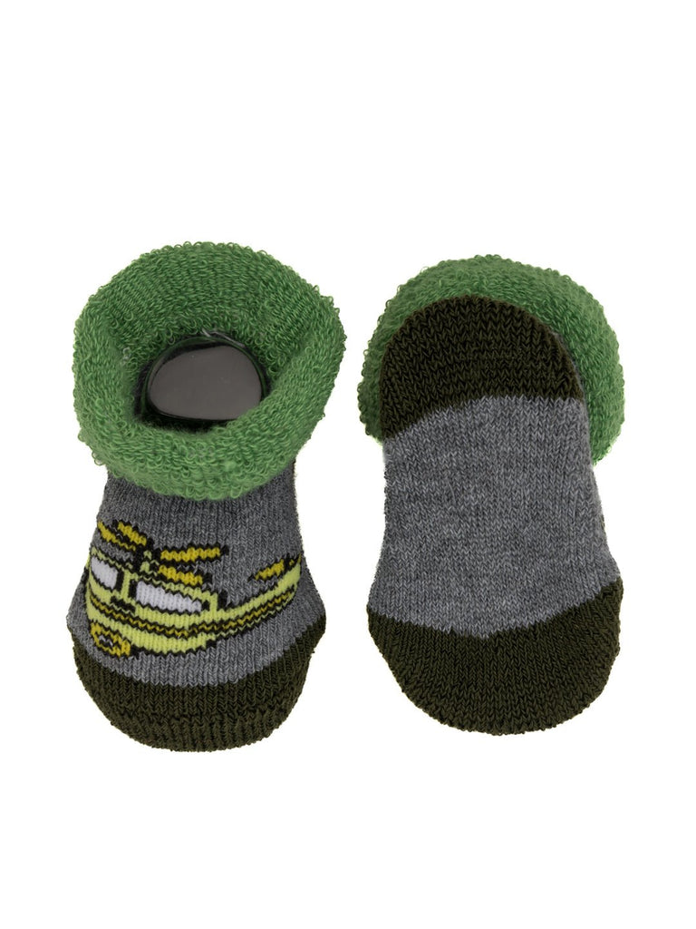 Green and gray kids' socks with helicopter design, displayed on a reading book background.
