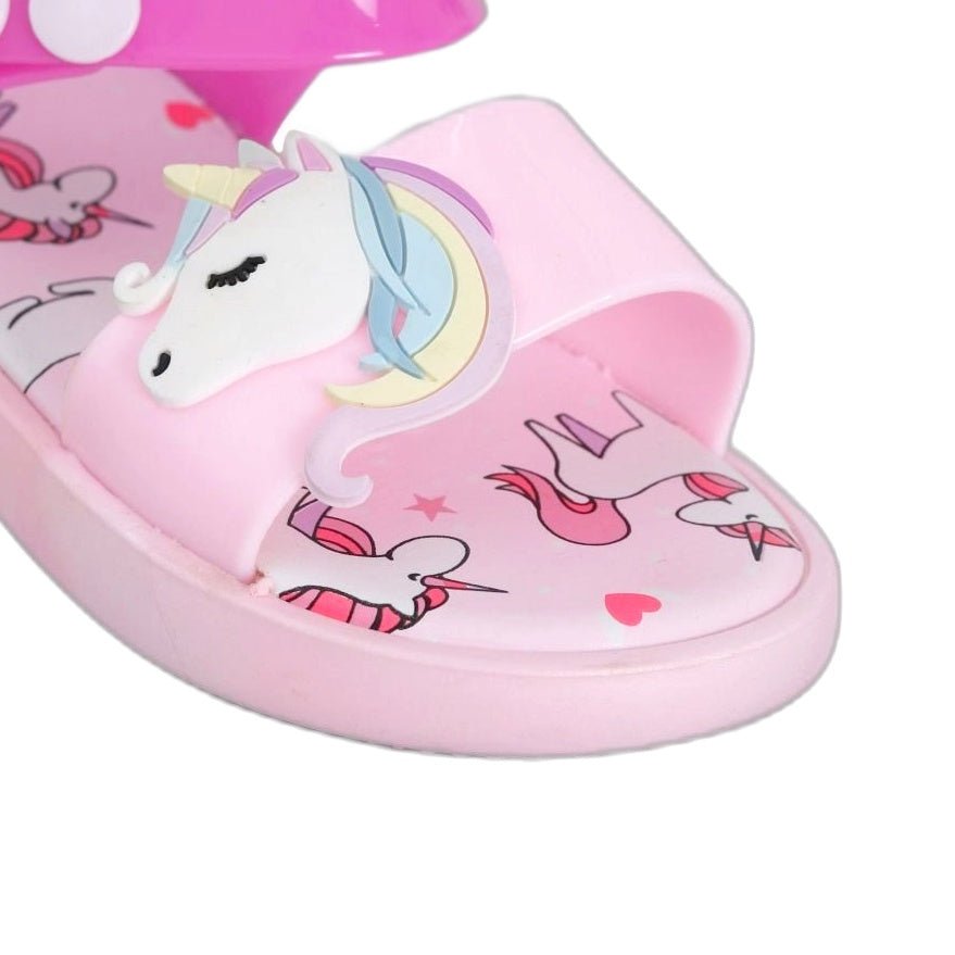 Close-up of the unicorn charm on pink children's sandal