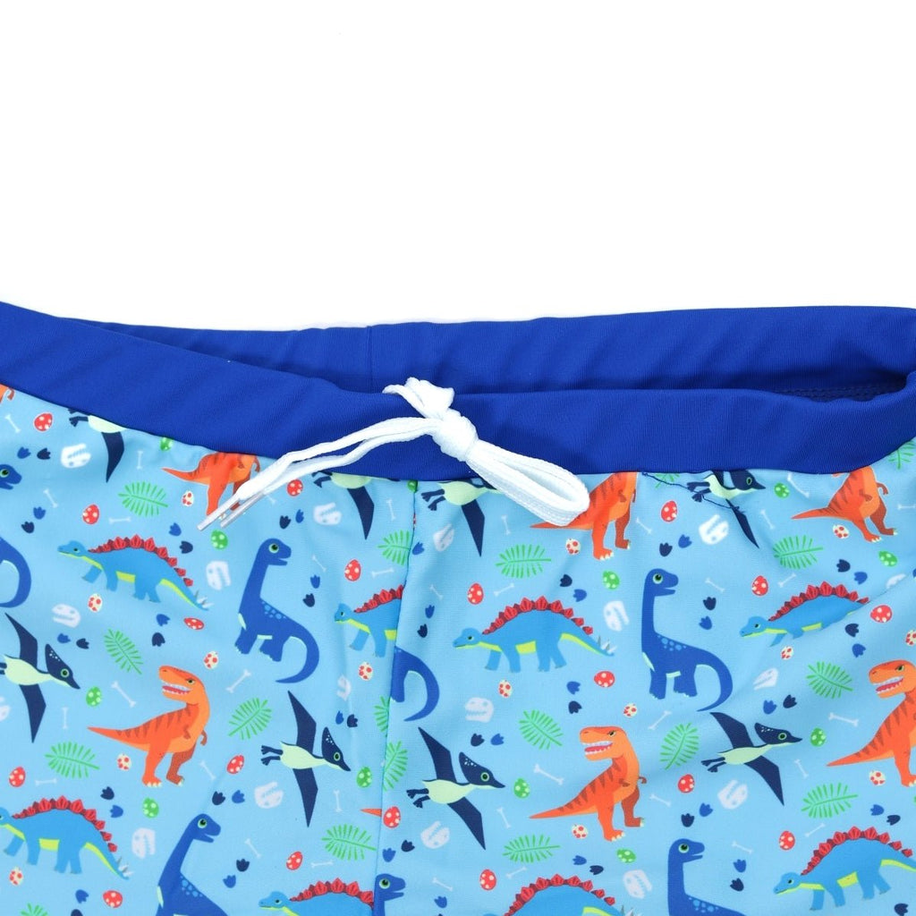 Detail shot of Yellow Bee's Boys' Swim Trunks featuring an adjustable drawstring and colorful dinosaur patterns