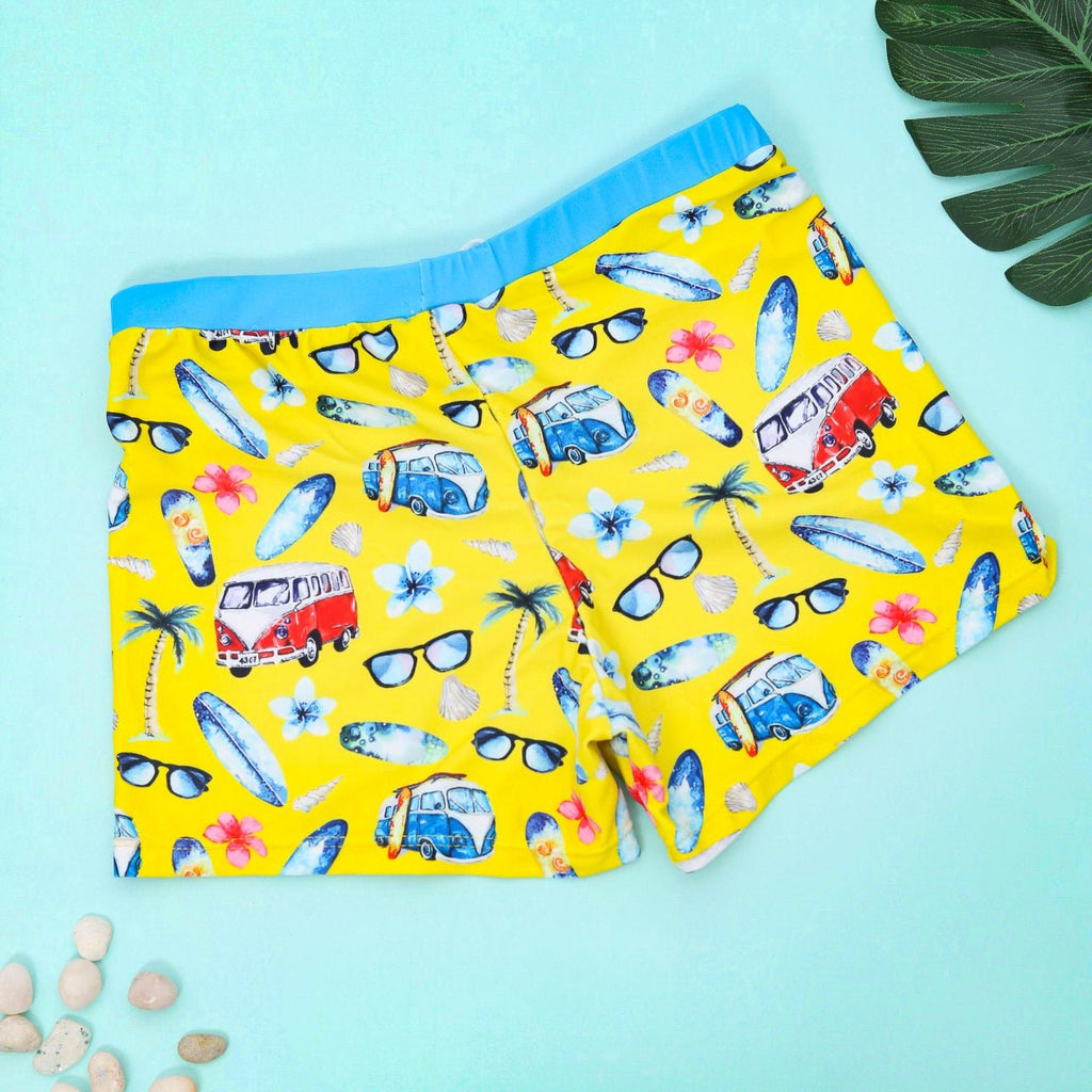 Boys' Yellow Beach Print Swim Trunks by Yellow Bee, showcasing a playful vacation vibe