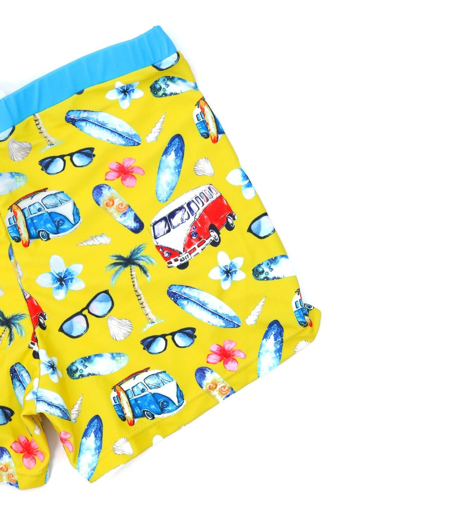 Bright and Colorful Yellow Bee Swim Trunks for Boys with Beach prints, side view.